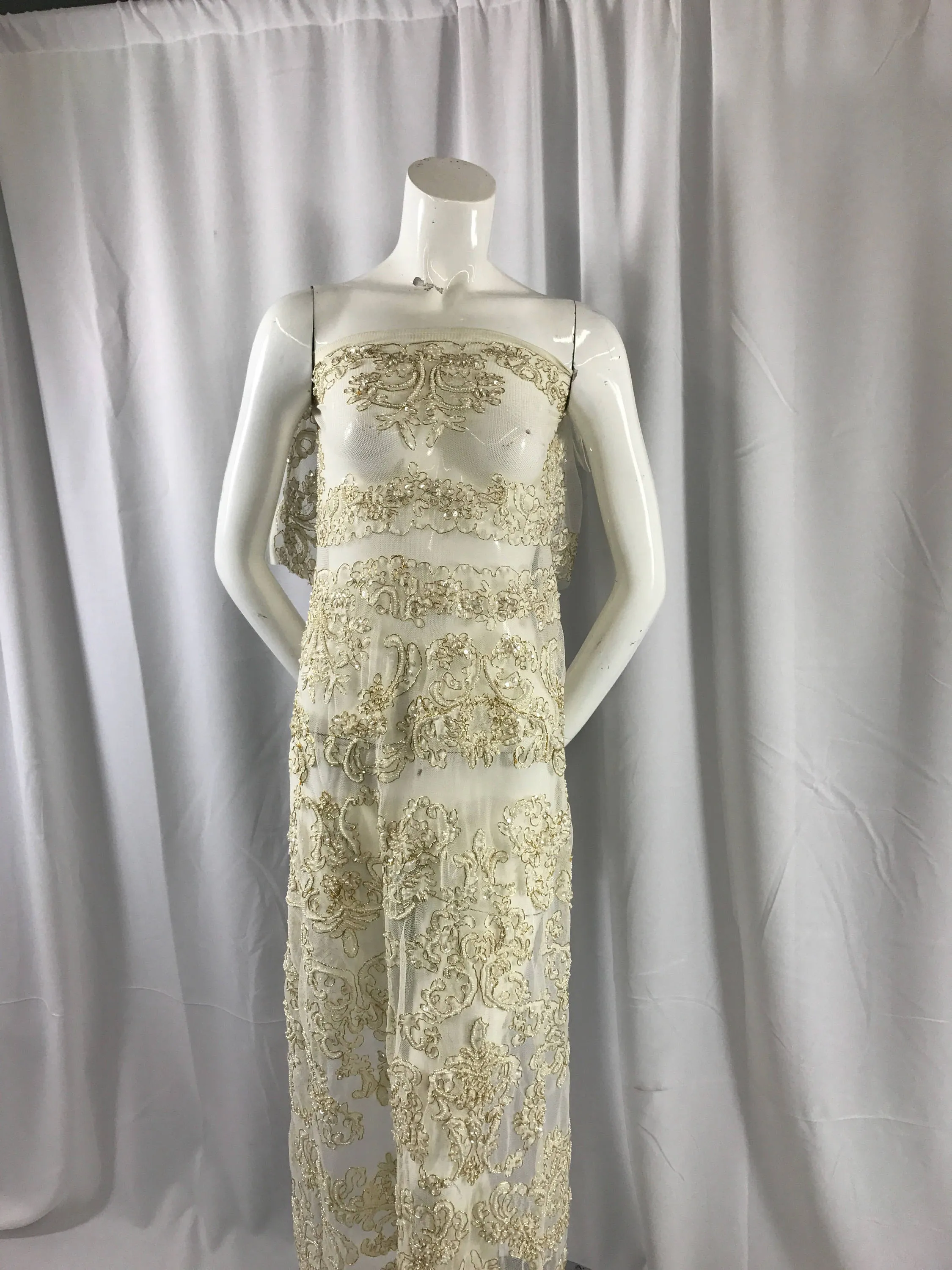 Ivory/metallic gold french design embroider and hand beaded with pearls ans sequins on a mesh lace-dresses-fashion-apparel-Sold by the yard.